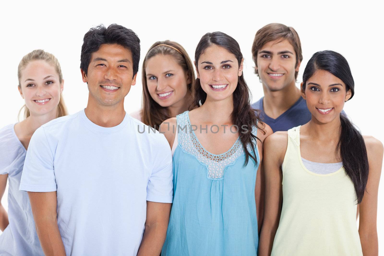 Close-up of people smiling together  by Wavebreakmedia