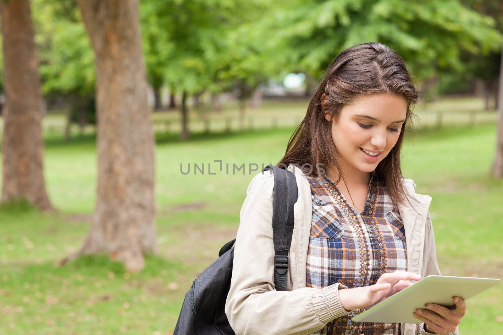 First-year student using a touch pad in a park