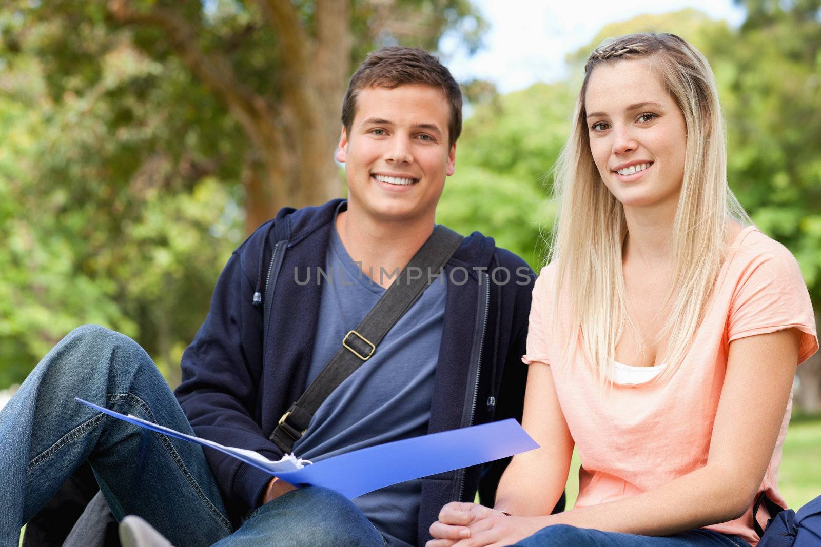 Portrait of a tutor helping a teenager to revise  by Wavebreakmedia