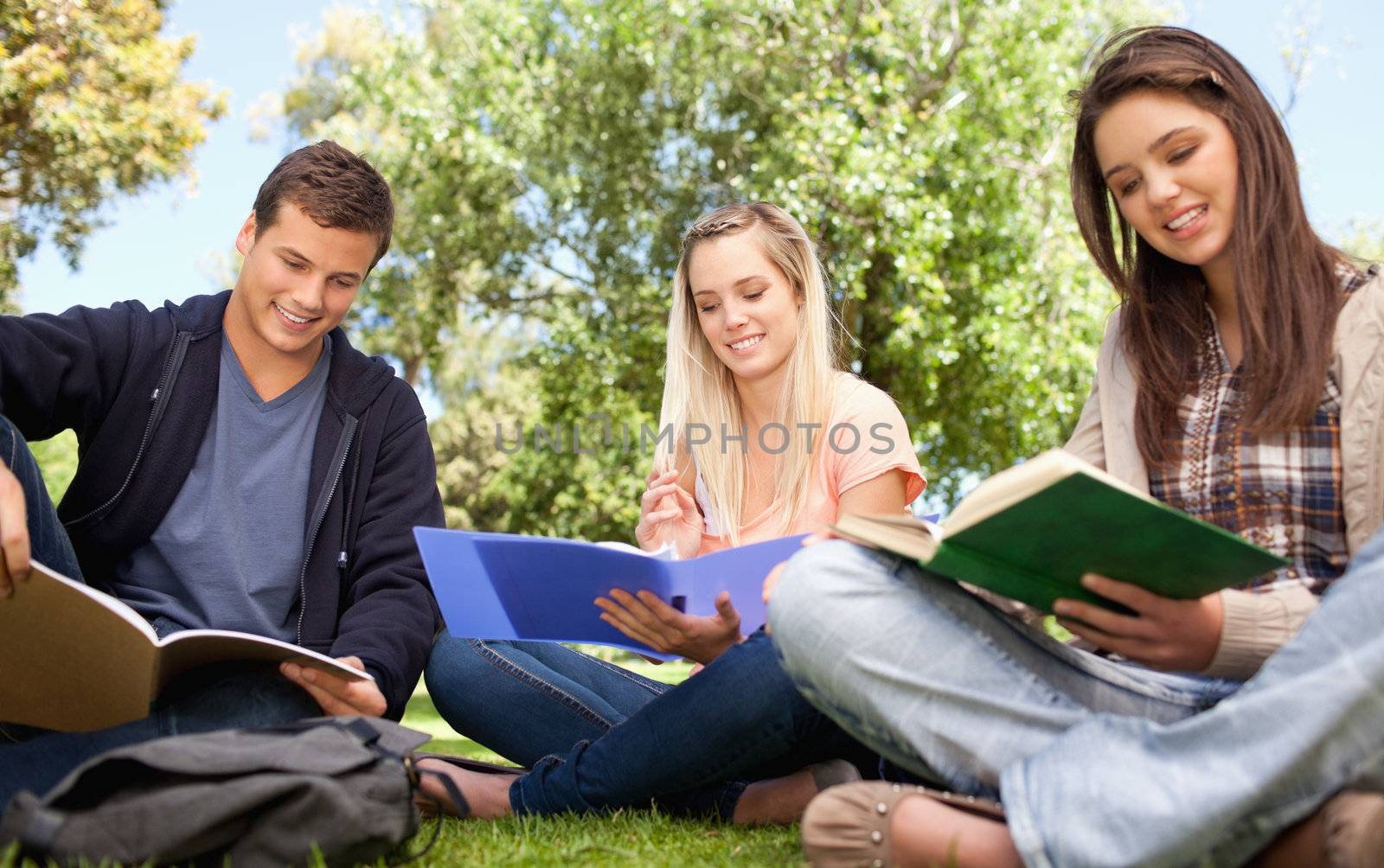 Low angle-shot of young people studying by Wavebreakmedia