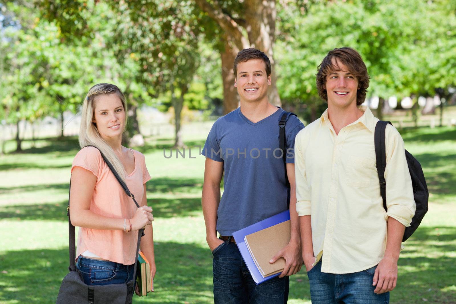 Portrait of a girl in front of two students by Wavebreakmedia