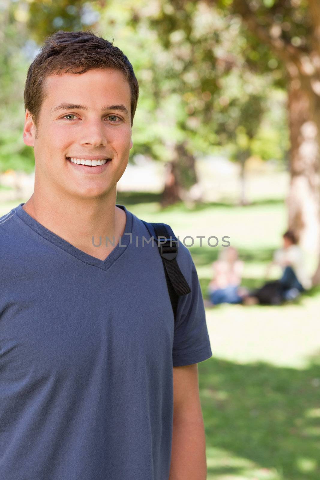 Portrait of a male student smiling by Wavebreakmedia