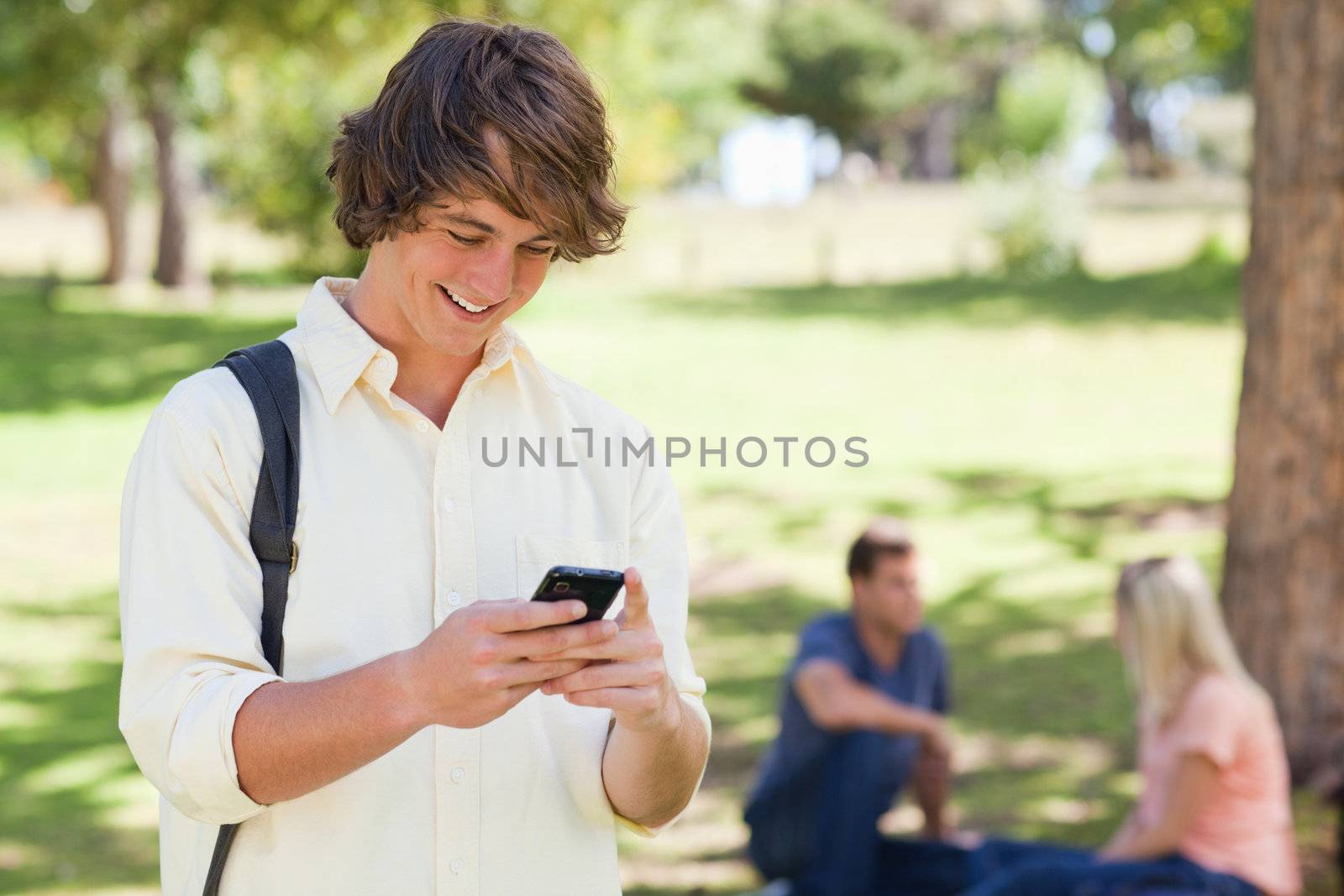 Close-up of a young man using a smartphone by Wavebreakmedia