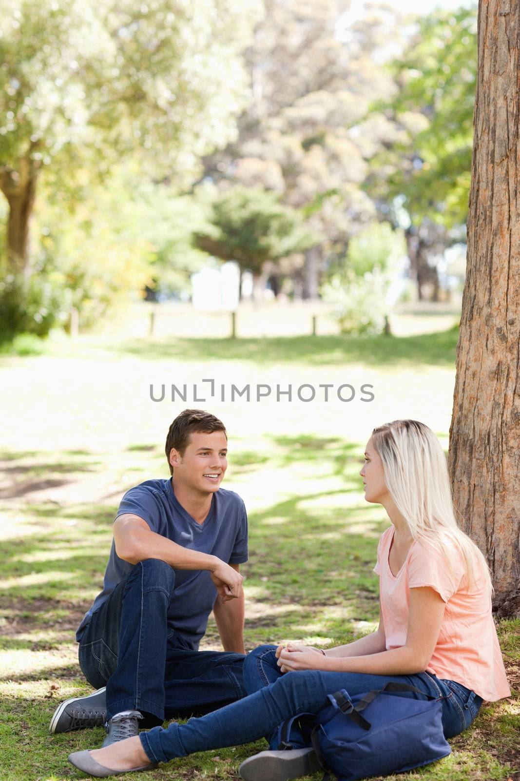 Students flirting in a park