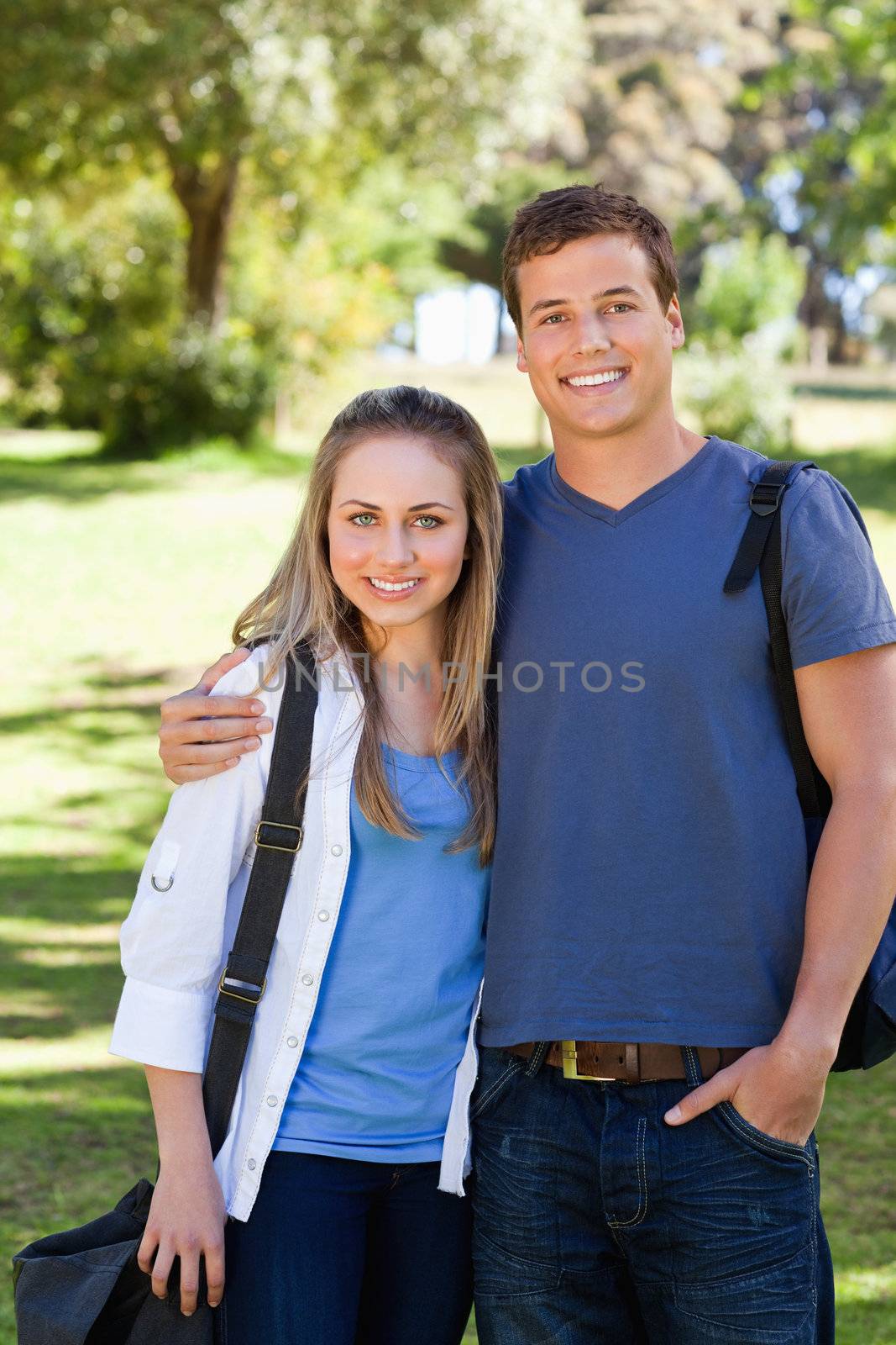Portrait of a student couple in a park