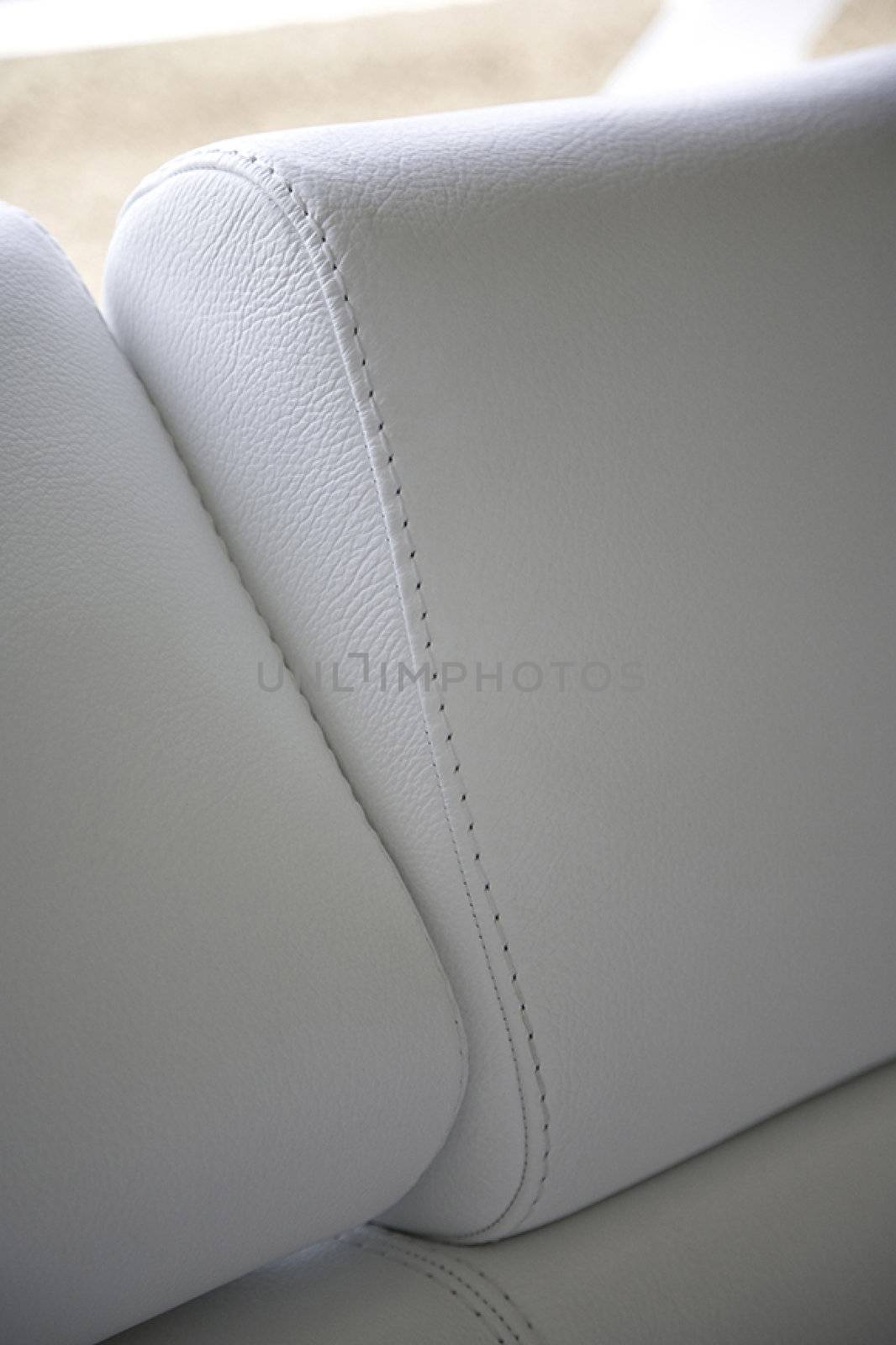 White armchair close-up with surface and sewing detail