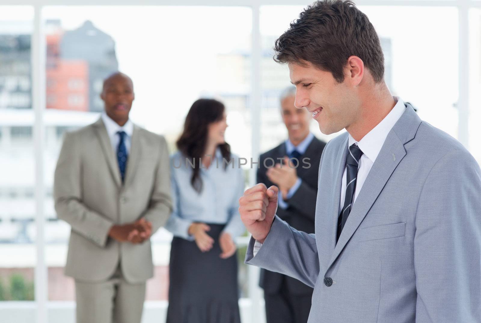 Businessman using his fist to show his great success