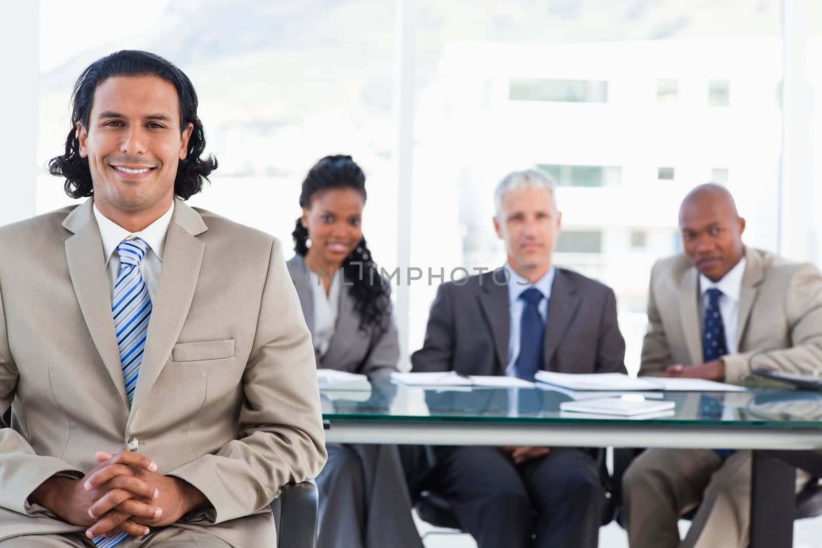 Businessman smiling while sitting with her hands crossed by Wavebreakmedia