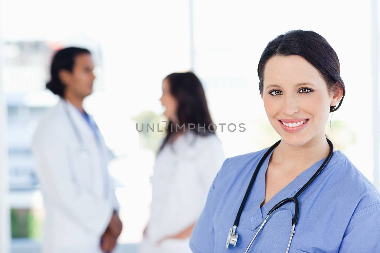 Young and confident medical intern looking at the camera with a great smile