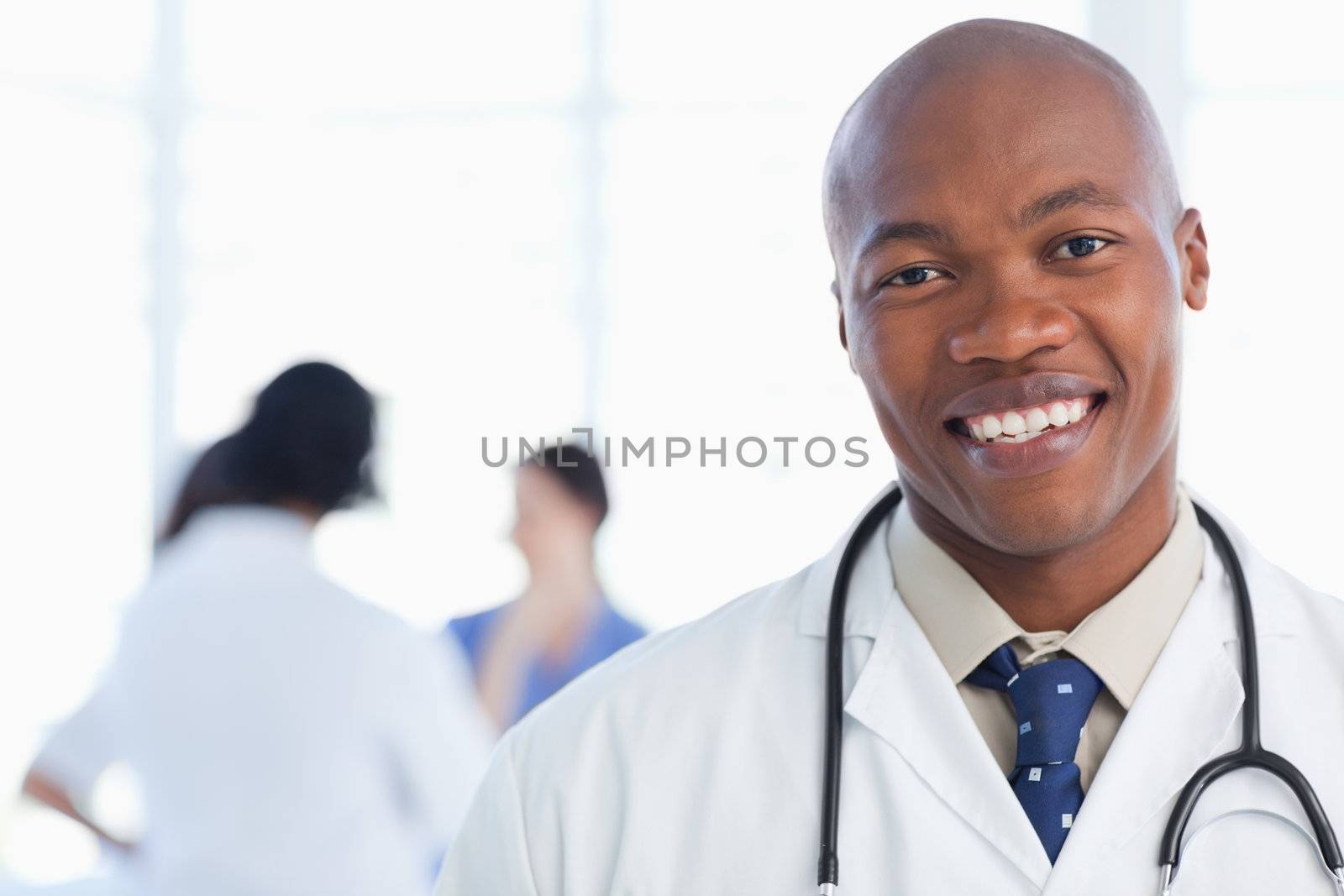 Young doctor standing with his stethoscope around his neck