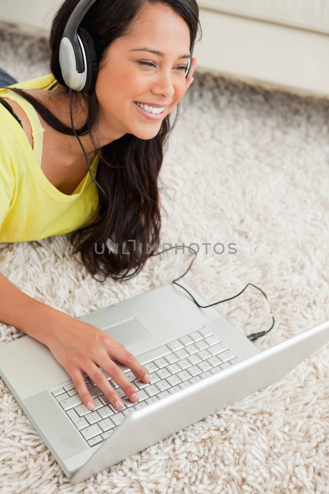 Close-up of a happy Latin chatting on a laptop by Wavebreakmedia