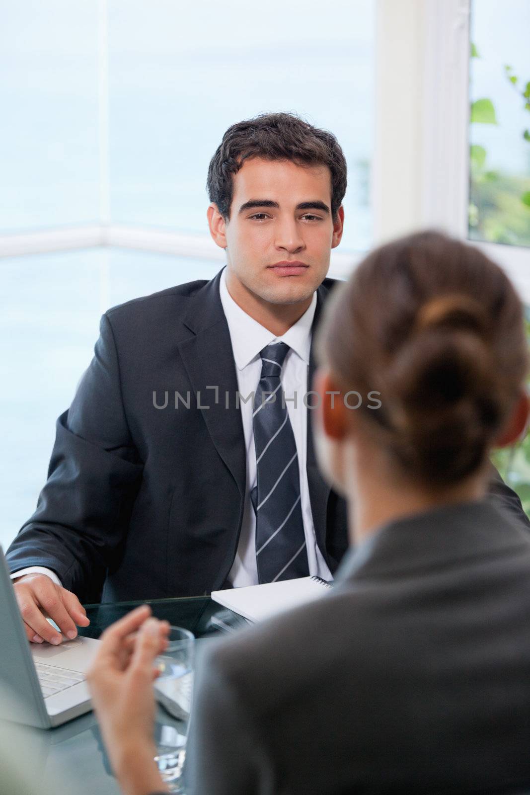 Businessman looking at his client in an office