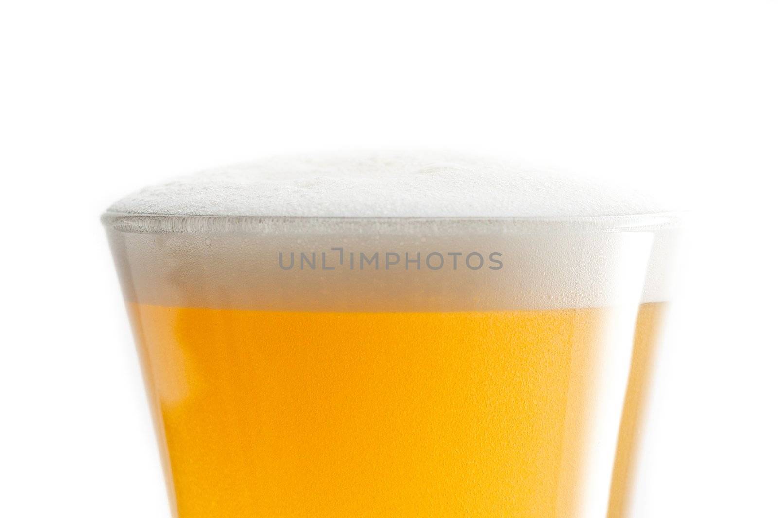 Full glass of beer against a white background