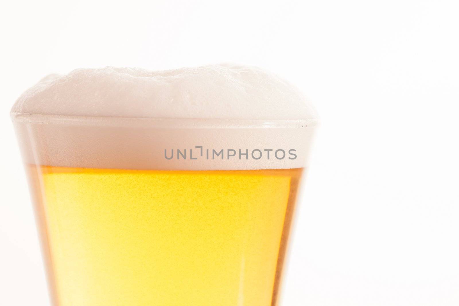 Top of glass full of beer and foam by Wavebreakmedia