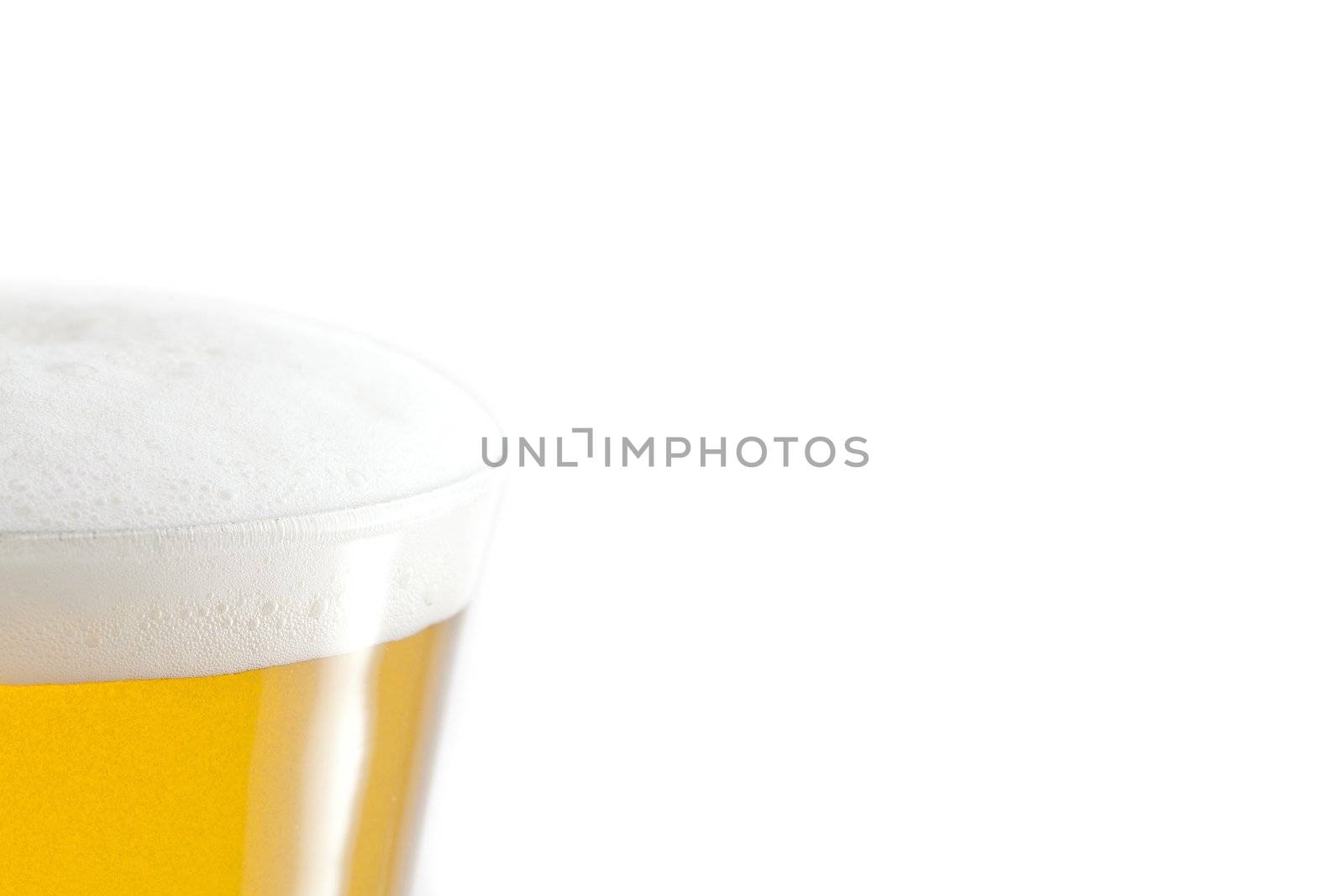 Full glass of beer and foam against a white background