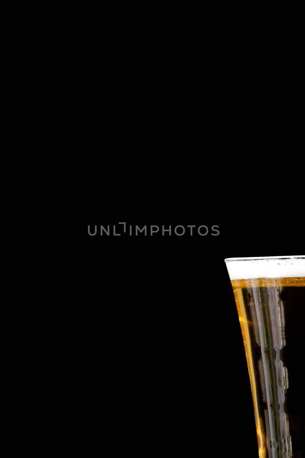 Glass full of foam and beer by Wavebreakmedia