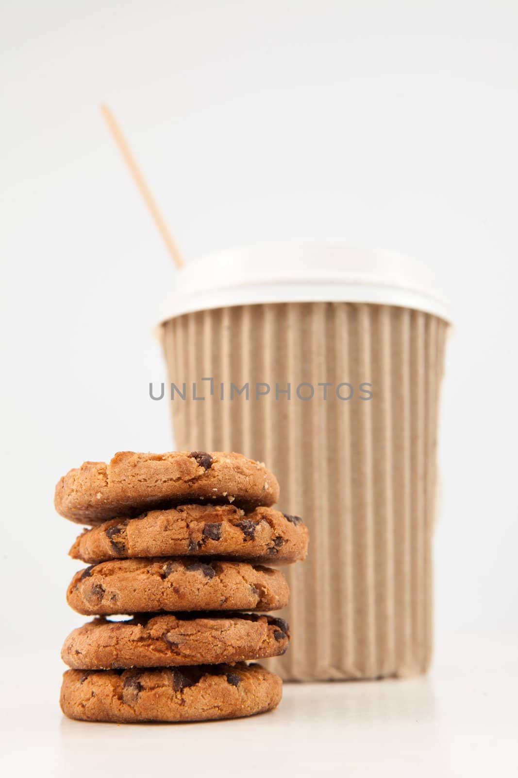 Five cookies and a cup of tea placed together by Wavebreakmedia