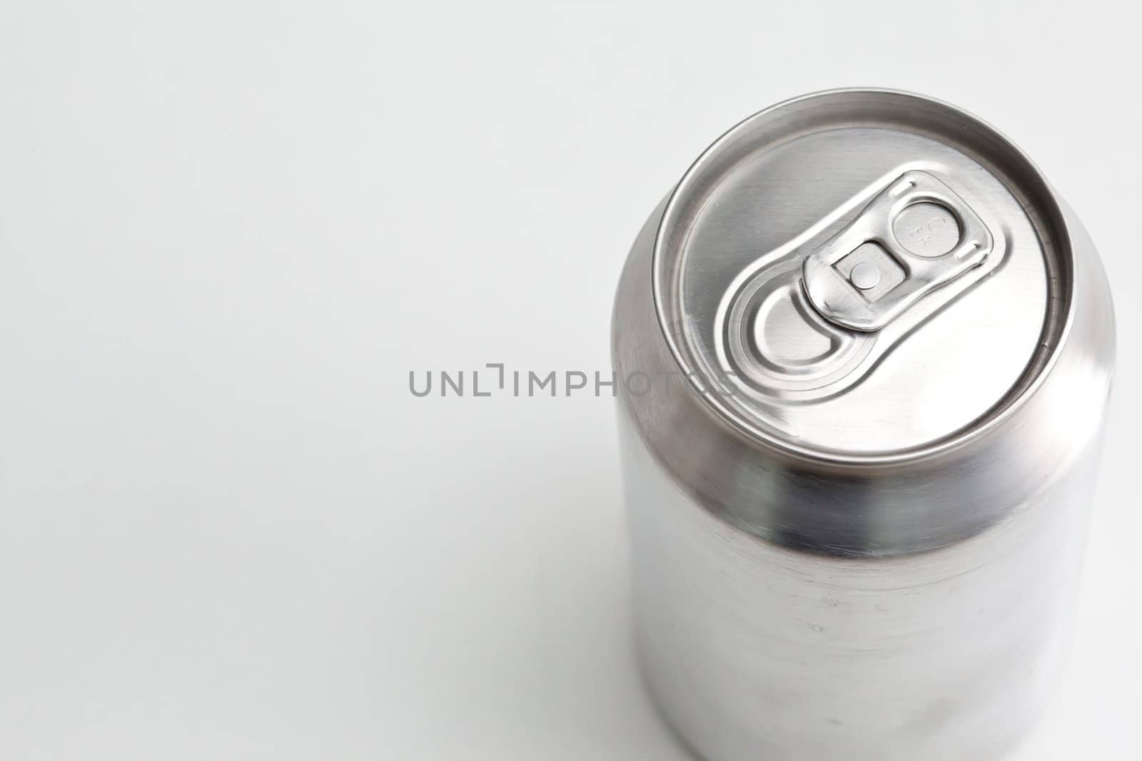 Overhead view of a closed aluminium can against a white background