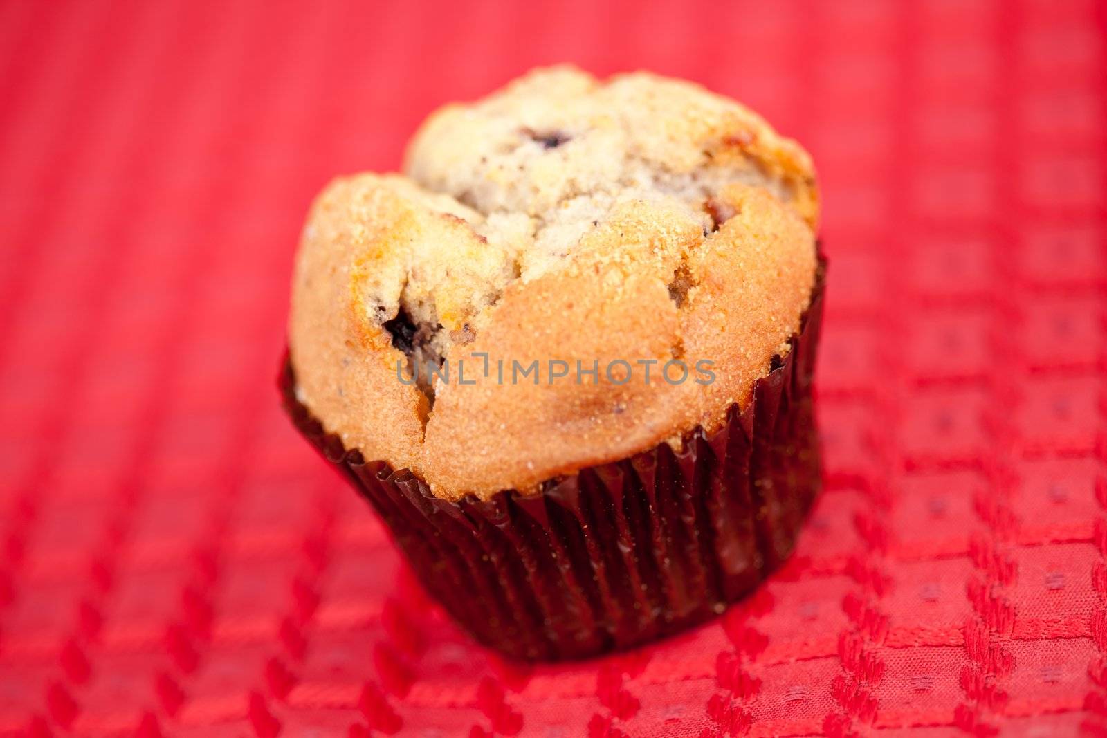 Muffin on tablecloth by Wavebreakmedia
