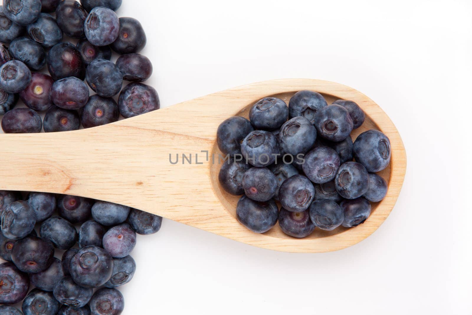 Wooden spoon with blueberrry by Wavebreakmedia