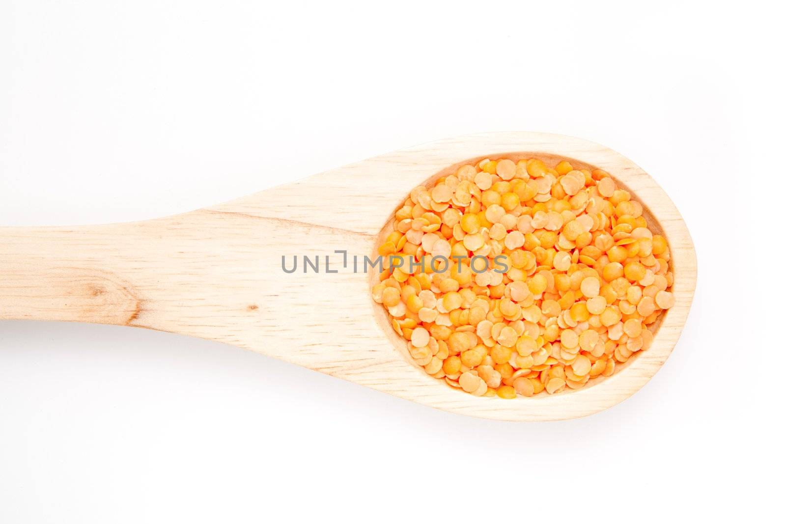 Wooden spoon with lentils by Wavebreakmedia