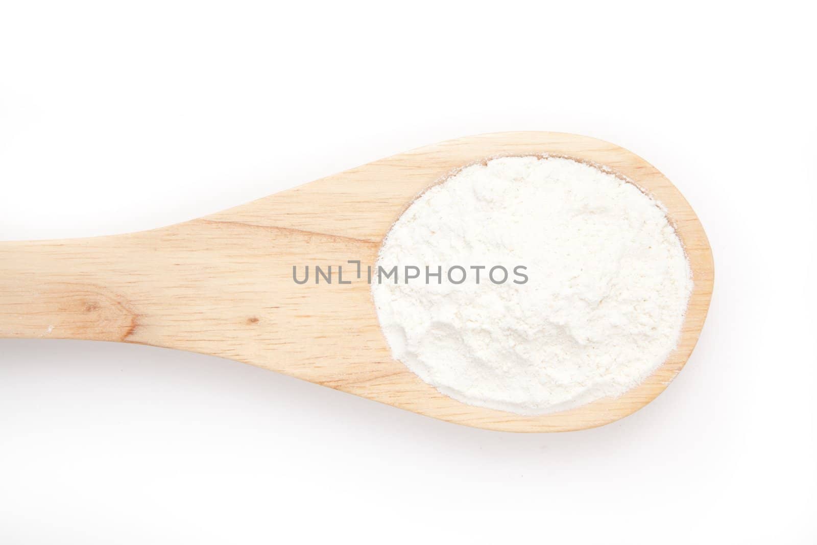 Wooden spoon with flour by Wavebreakmedia