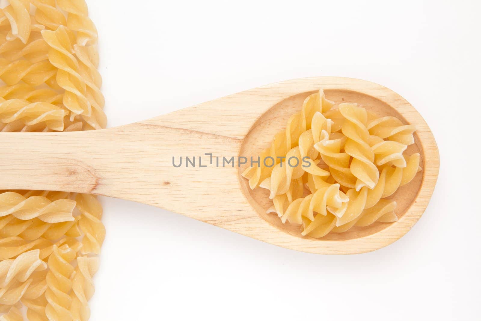 Wooden spoon with pasta by Wavebreakmedia
