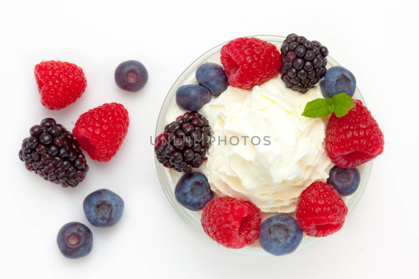 Dessert of berries against a white blackground