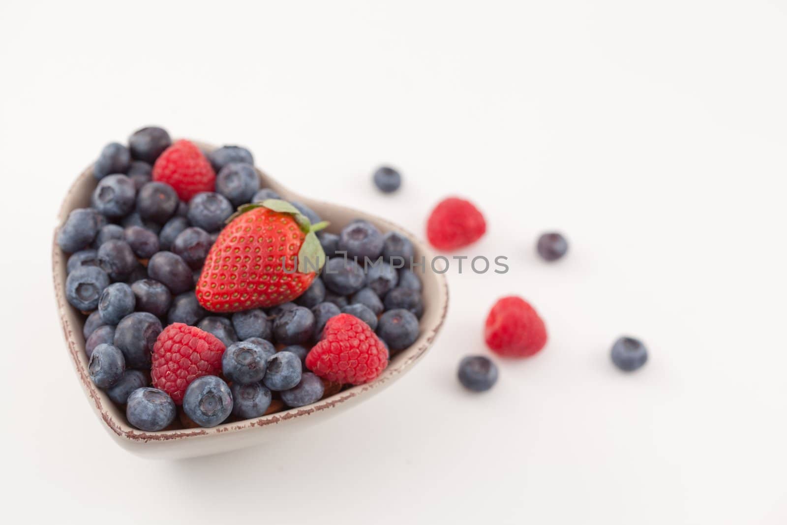 Bowl with berries  by Wavebreakmedia