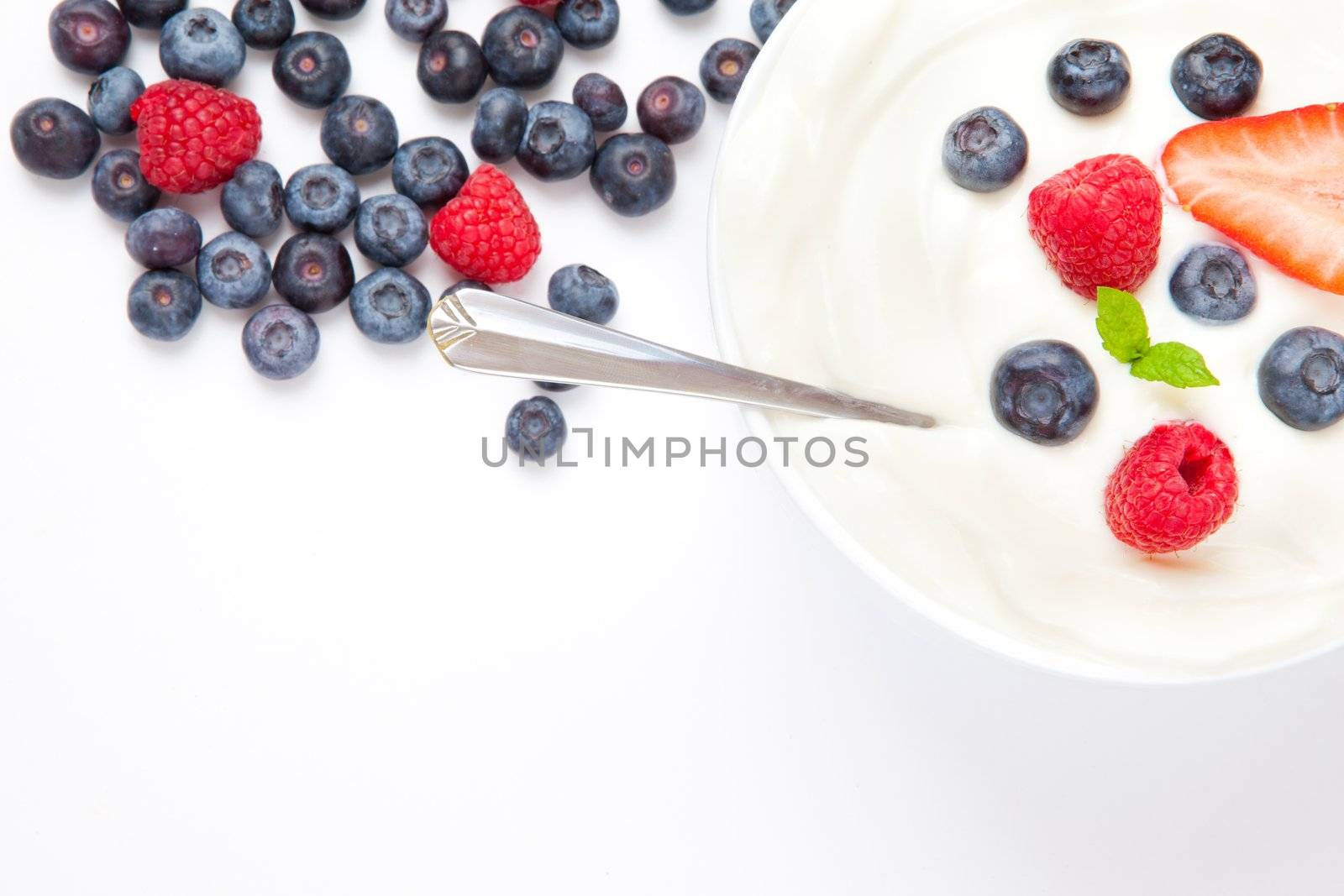 Dessert of berries with cream by Wavebreakmedia