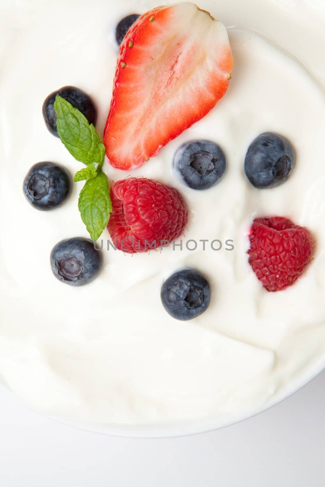 Berries in a white cream by Wavebreakmedia