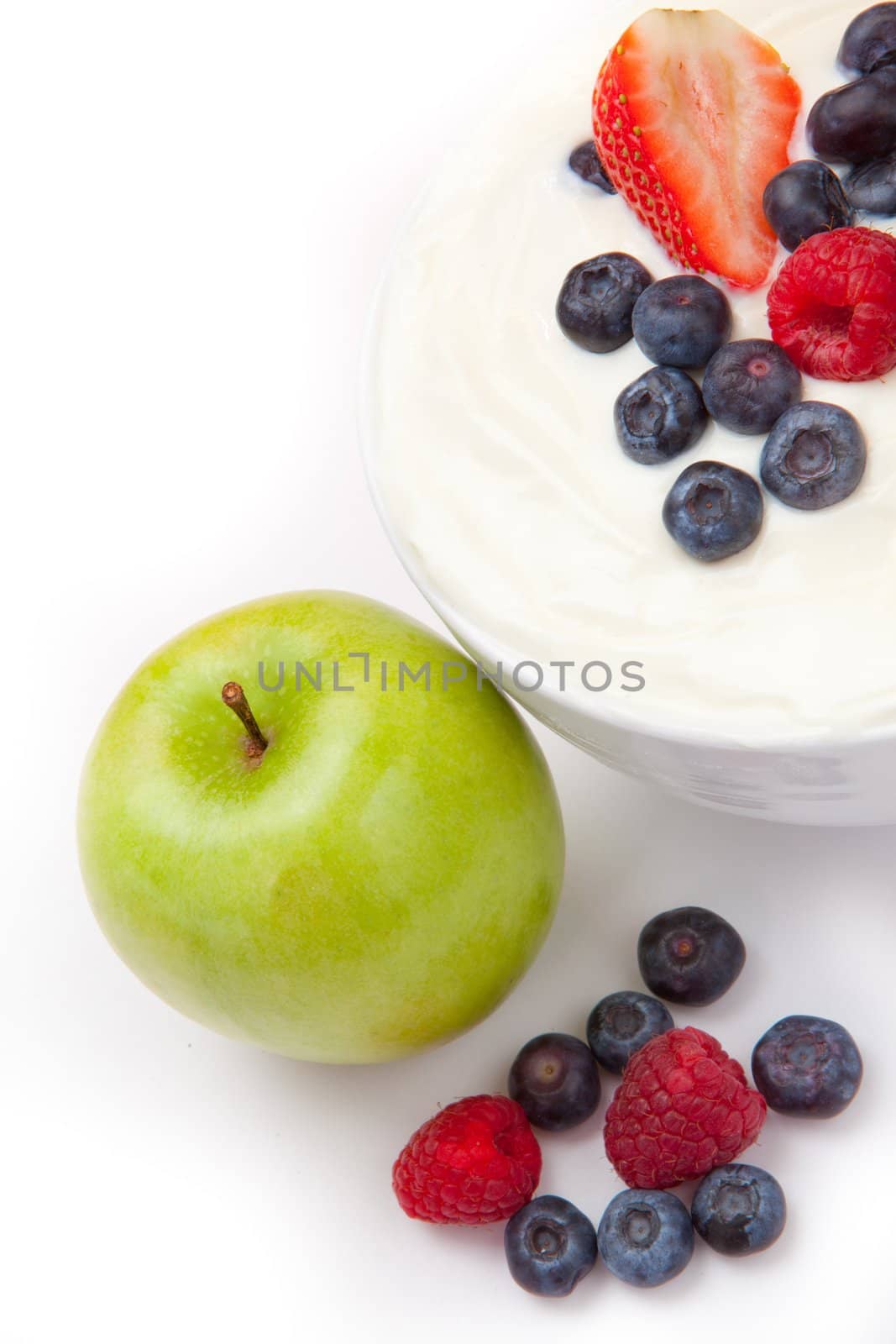 Berries cream and apple  against a white background