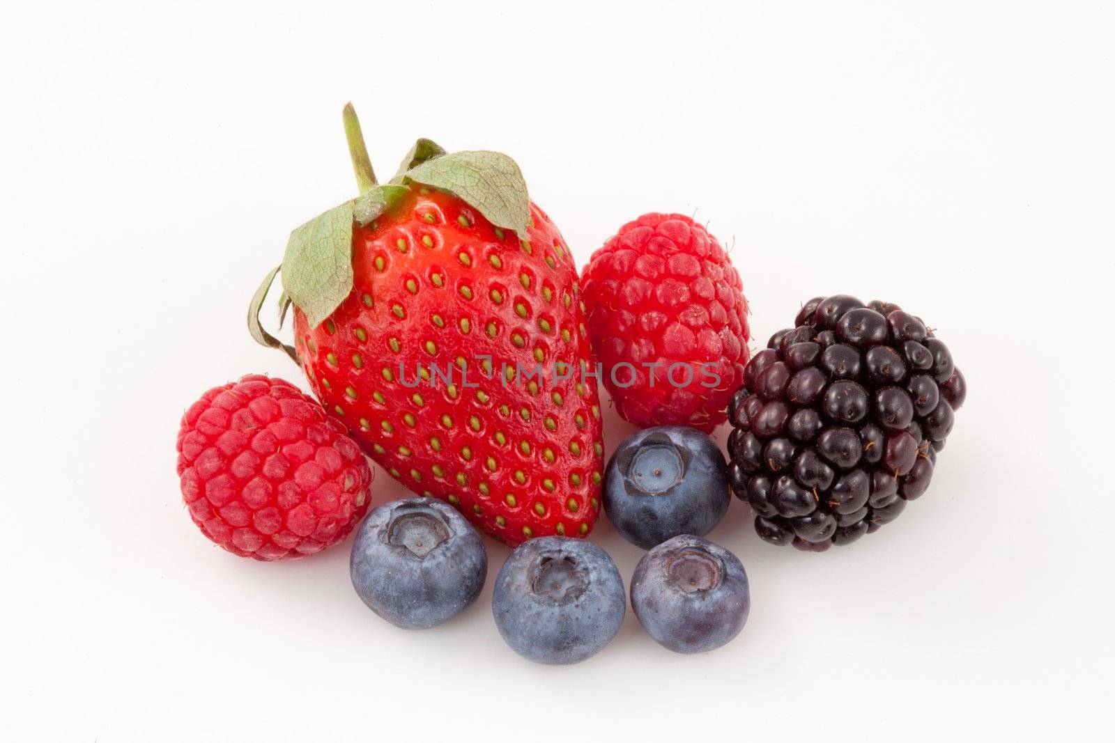 Fruits laid out together against a white background
