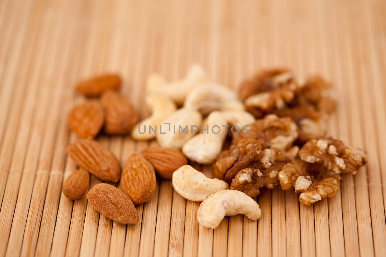Nuts laid out together on a wooden placemat