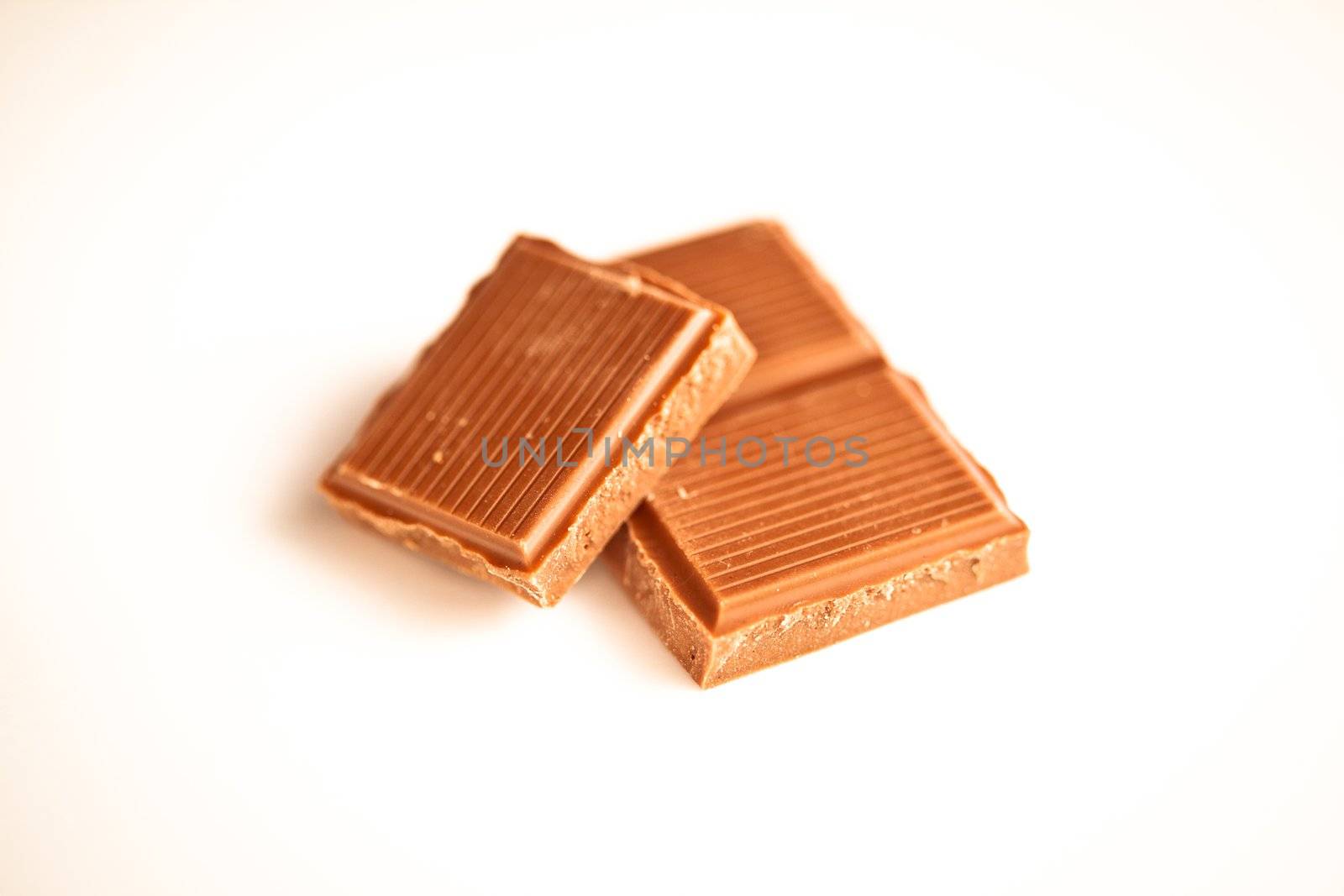 Chocolate pieces against a white background