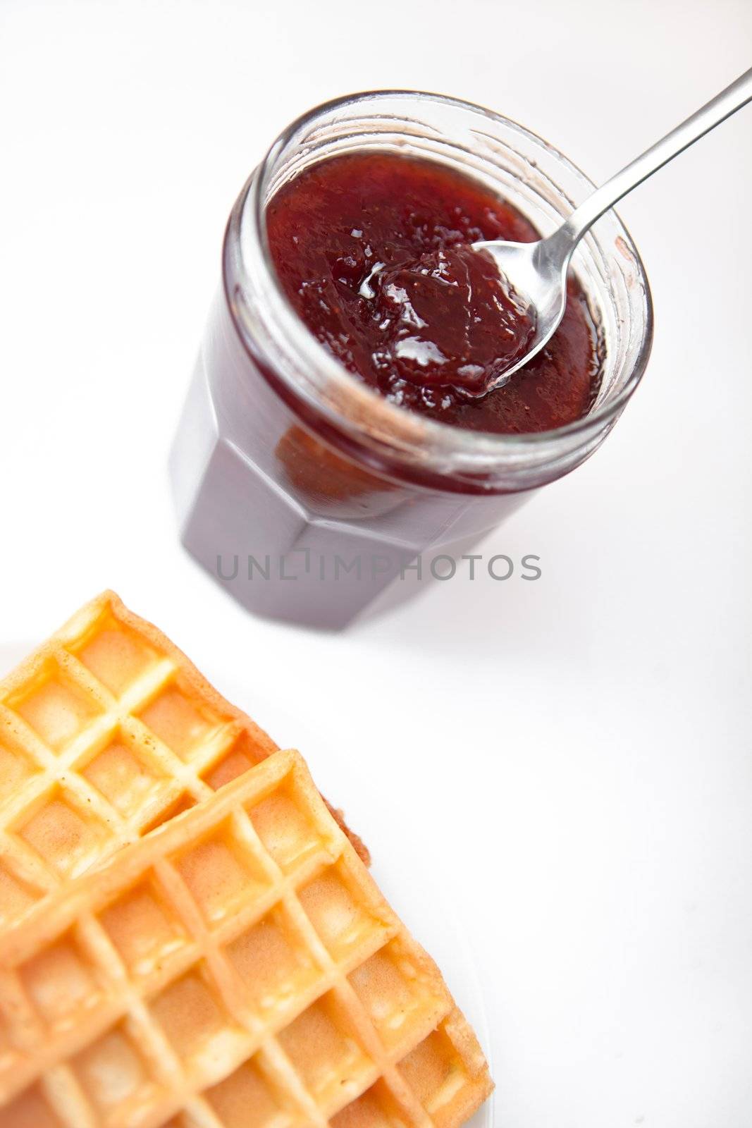 Breakfast with waffles against white background