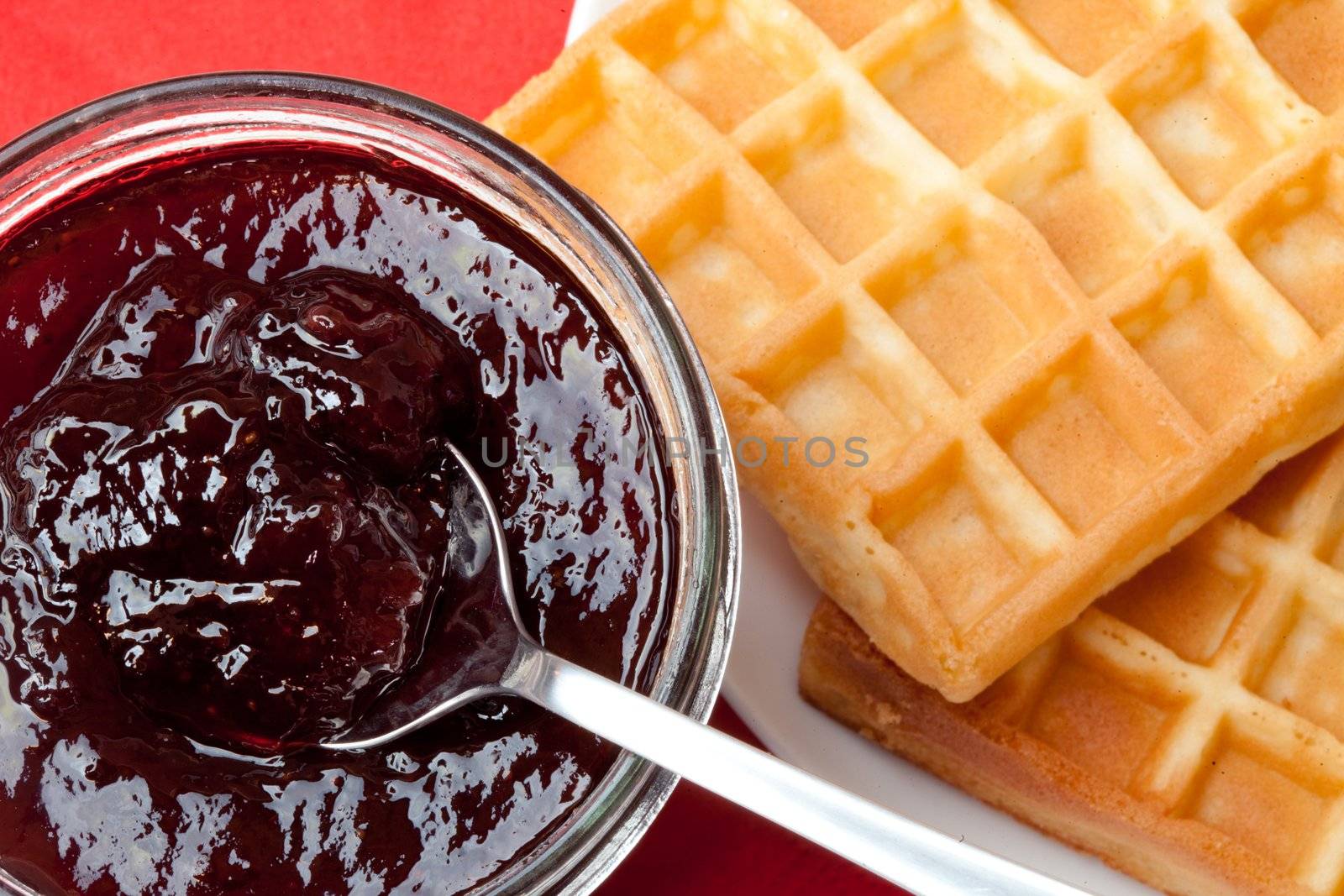 Breakfast with waffles and jam on the table