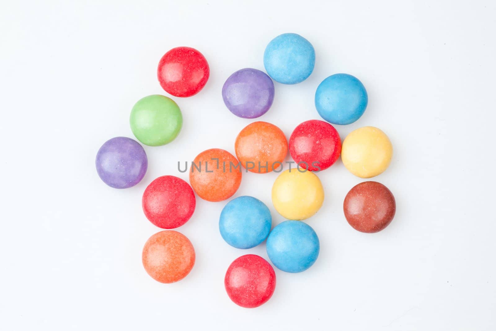 Candies multi coloured against white background