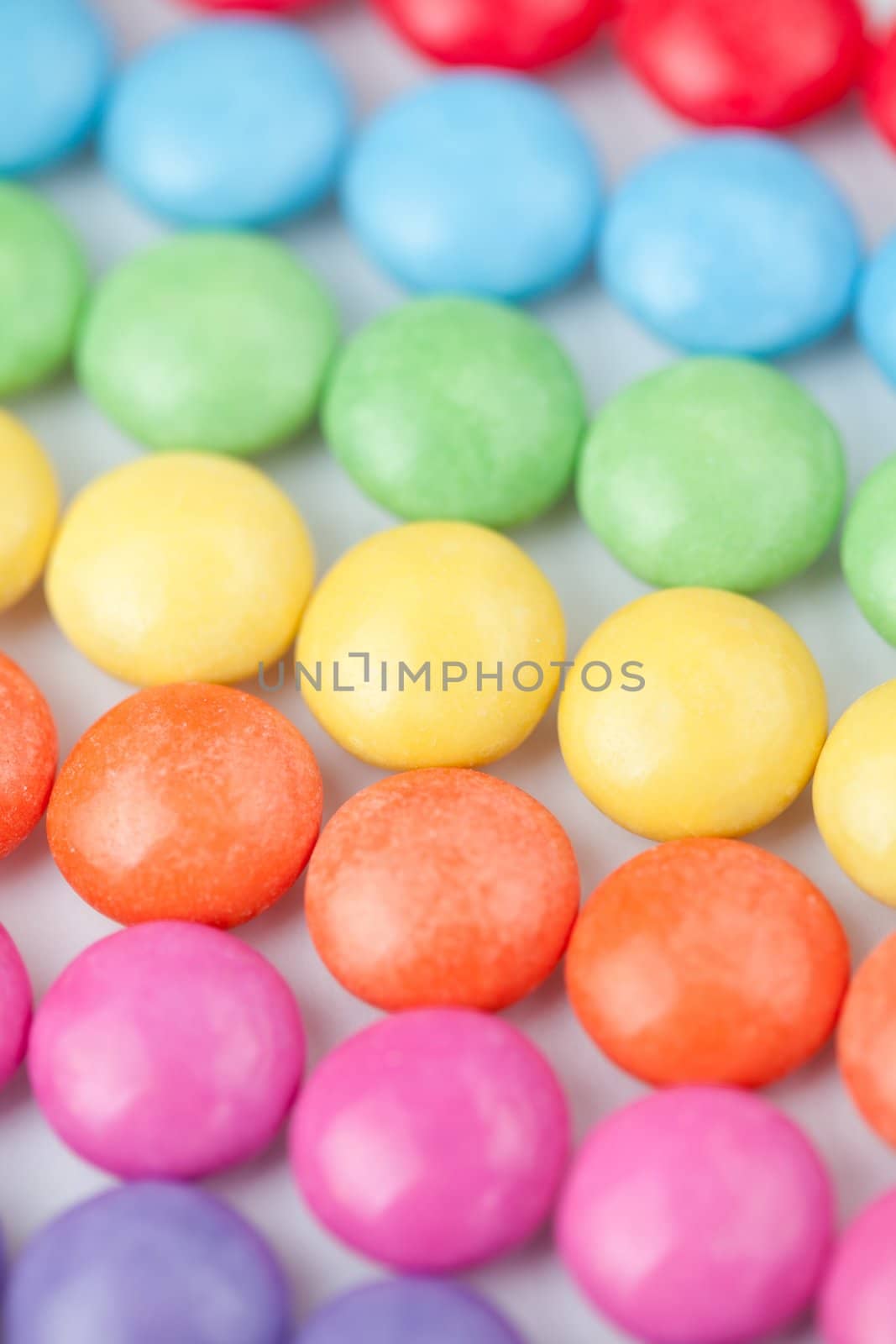 Candies multi coloured against a white background