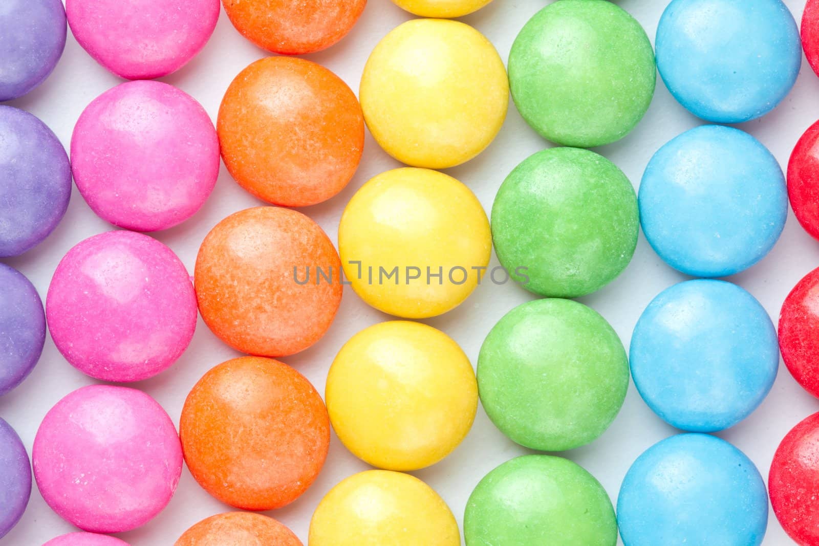 Candies multi colored against a white background
