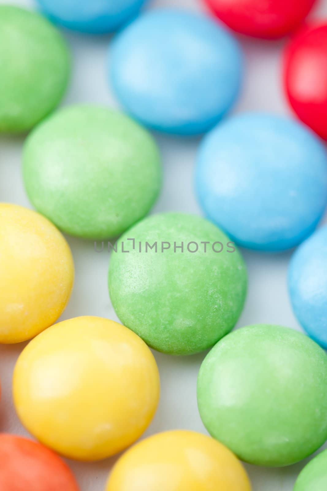 Chocolate sweetmeat multicolored against a white background