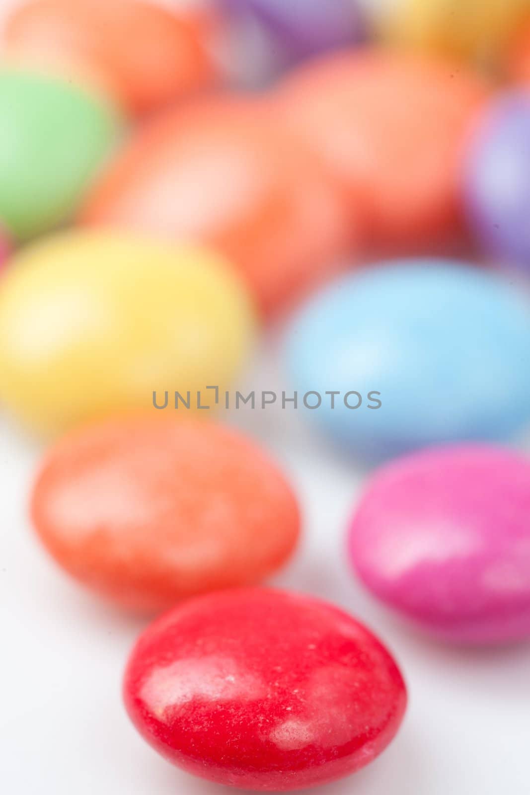 Chocolates multicolored against a white background