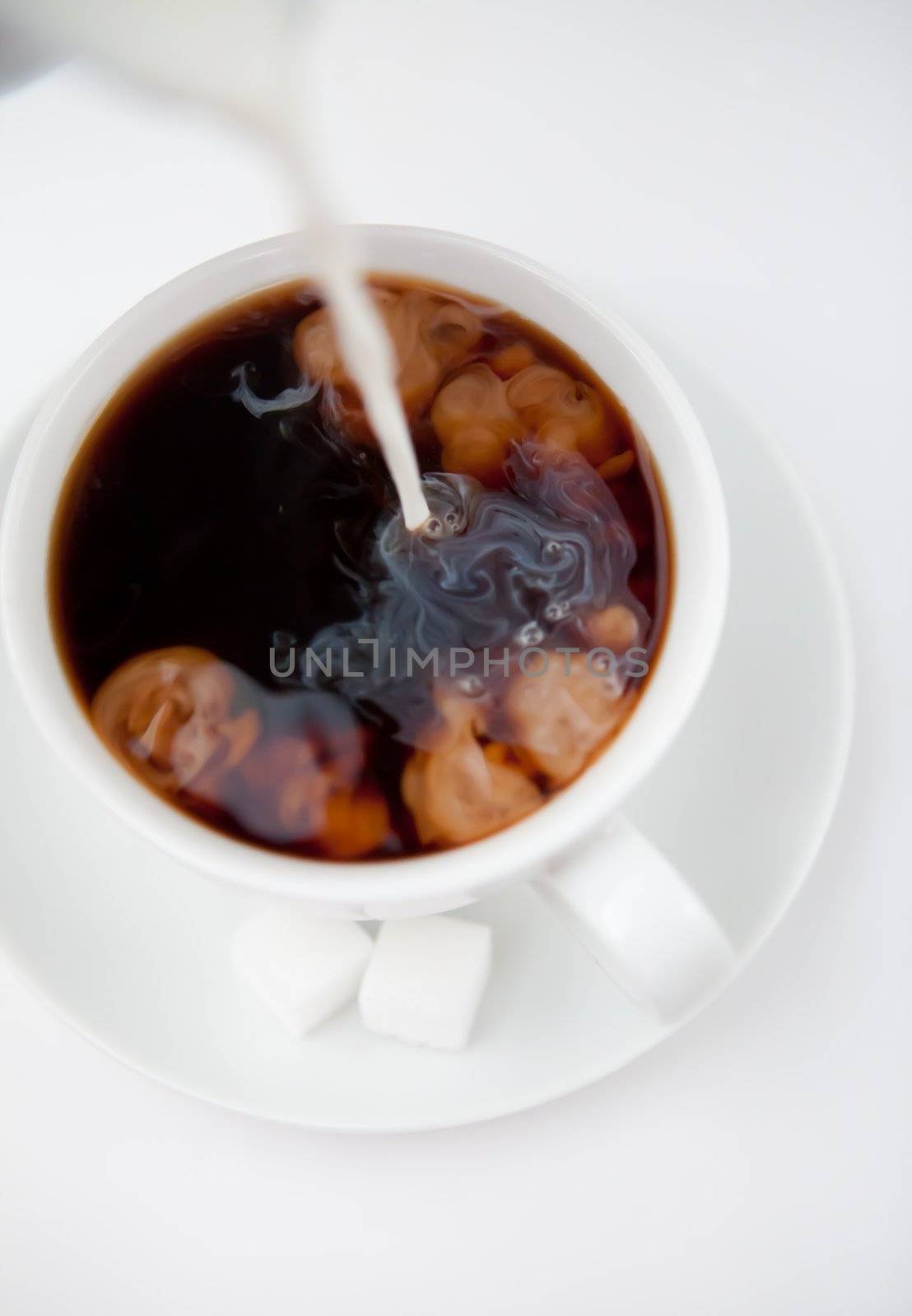 Milk and coffee against a white background