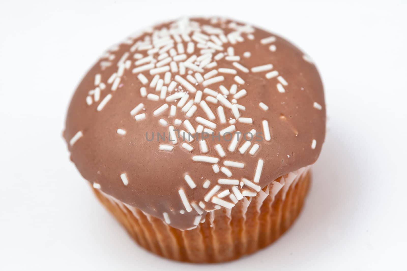 Brown cupcake against a white background