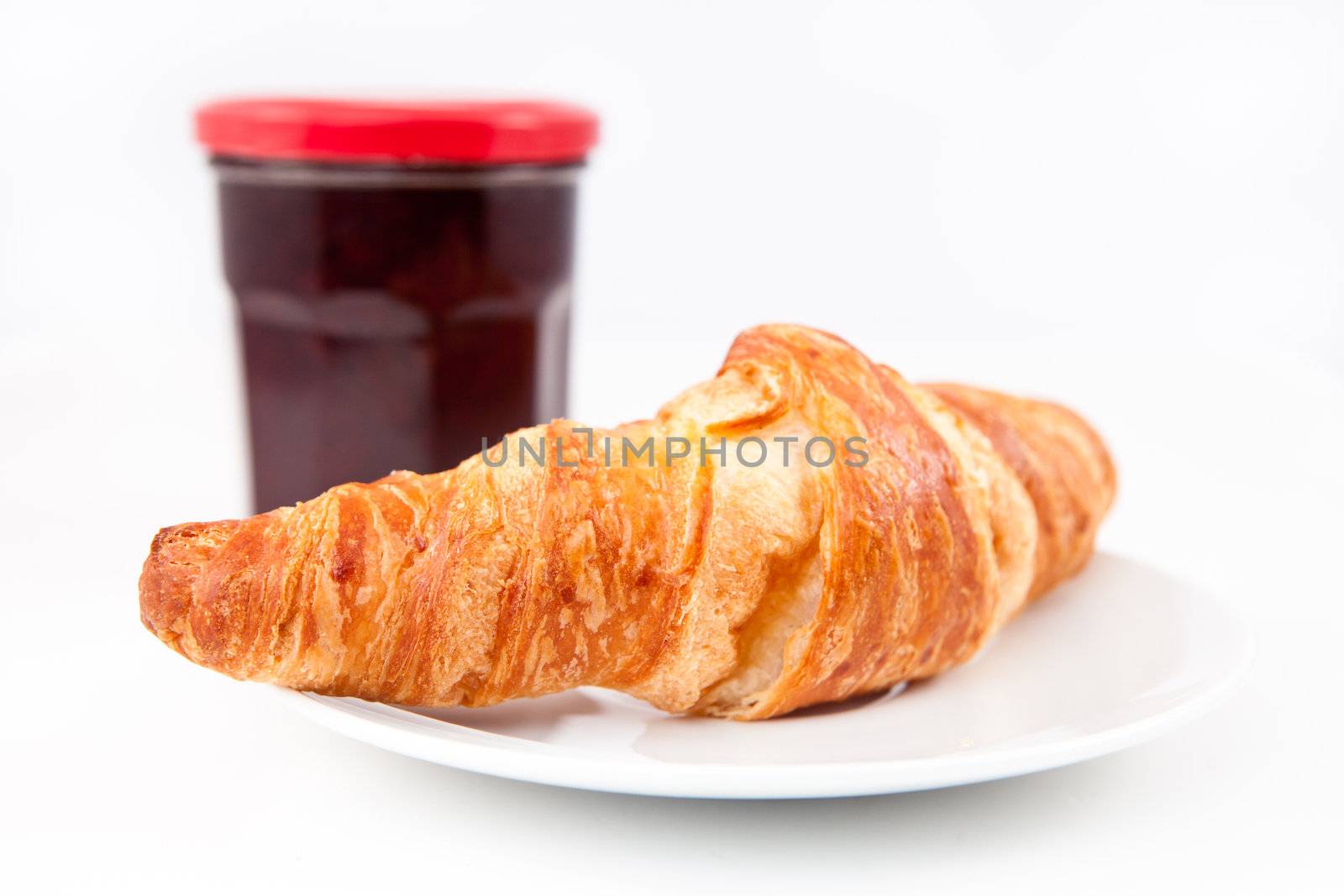 Breakfast with croissant  against a white background