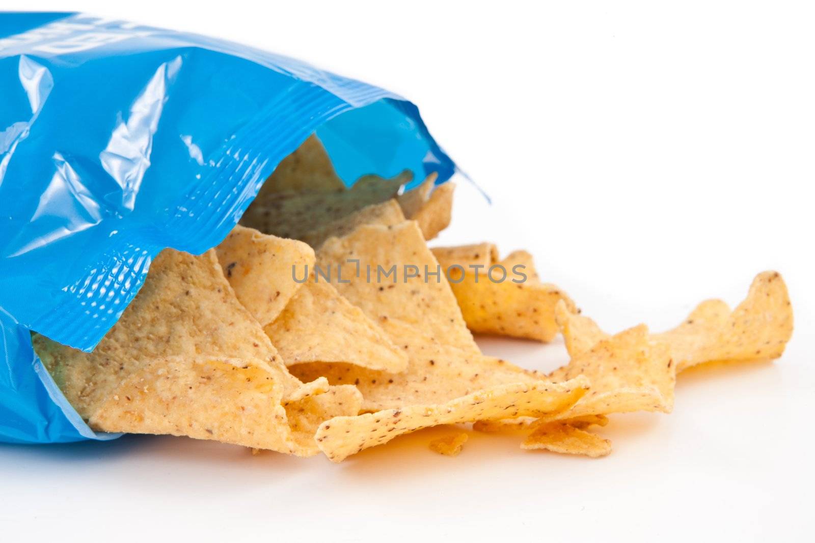 Open bag with fallen tacos against white background