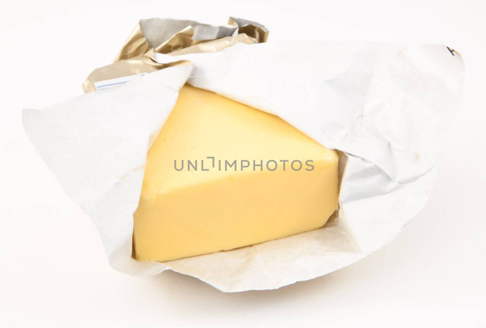Open pat of butter against white background