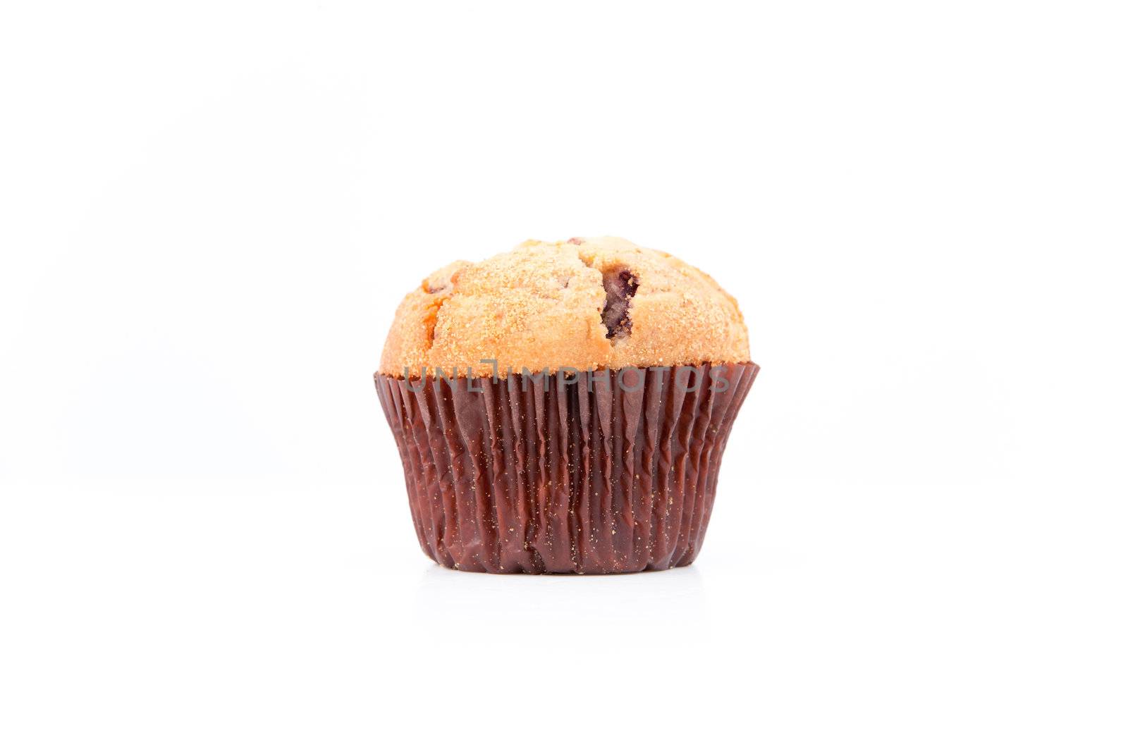 Fresh baked muffin against a white background