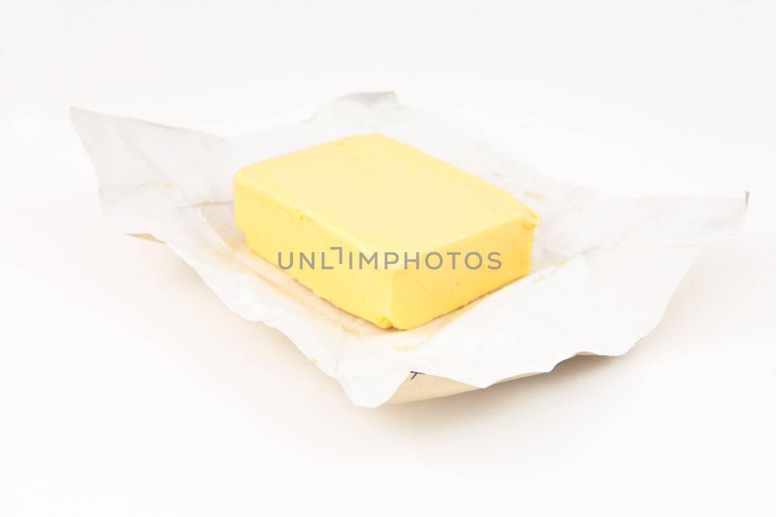 Pat of butter against white background