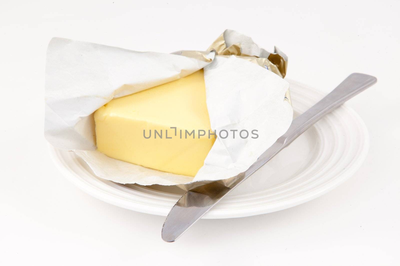 Butter on a saucer by Wavebreakmedia